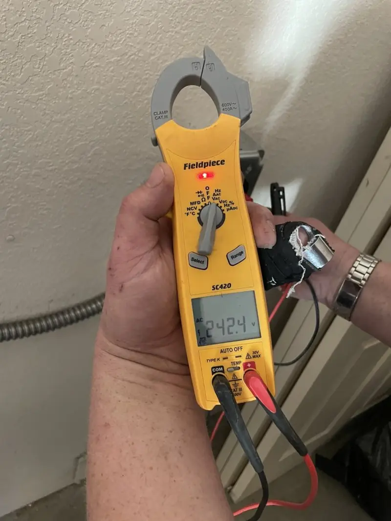 Voltage testing with clamp meter during Aluminum Wiring Replacement in Madison
